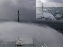 Sea spray in storm, from ship's bridge.