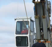 Image of Pam running a crane.