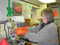 Image of Kathy preserving a water sample.