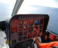 Helicopter control panel.  Healy at far left in larger photo