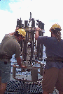 Image of TAO personnel retrieving water samples from the CTD array