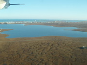 troughs formed in land where sub-surface permafrost (ice) melted