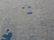 ponds formed by drainage in depressions caused by melting permafrost