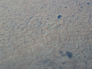 ponds formed by drainage in depressions caused by melting permafrost