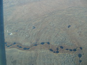 ponds formed by drainage in depressions caused by melting permafrost