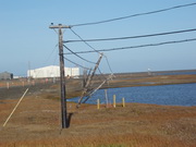 leaning telephone poles due to melting permafrost 