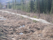 rural road damaged by melting permafrost 