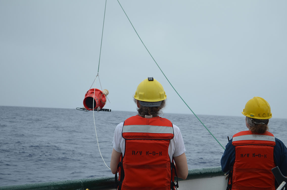 Dr. Elizabeth Steffen (left) and Marine Tech Elizabeth Ricci (right) deploy a Deep Argo float, capable of reporting temperature and salinity from 6 km to the ocean surface