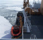 Looking aft: sun, shadows, ice path, zodiak. Photo by C.Ladd