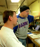 Image of two scientists looking at nutrient concentrations in the water column.