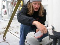 Scientist drawing off water samples