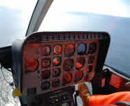 Helicopter control panel. Healy at far left in larger photo