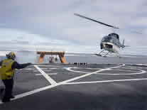 Helicopter landing on Healy's helo-pad
