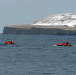 Zodiaks from the Healy off of St. George Island in the Pribilof Islands