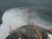 Healy breaking waves as it heads back to Dutch Harbor after a long Bering Sea Ice Expedition.