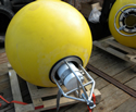 Yellow mooring float with ice profiler in frame. Photo by Scott McKeever