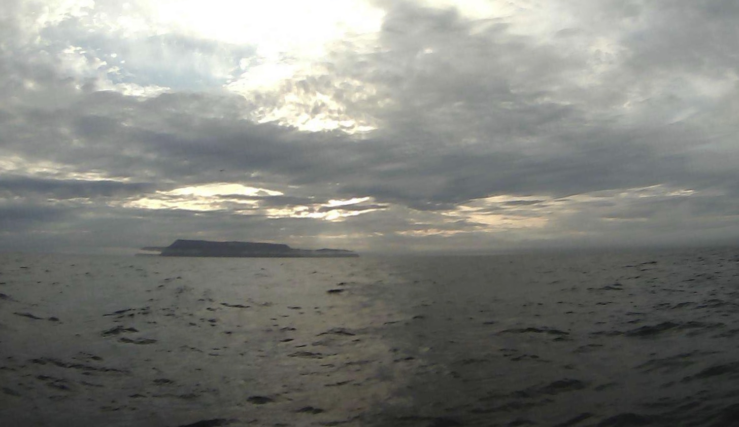 Drone view: A saildrone passes Little & Big Diomede Islands, of Alaska's Bering Sea.