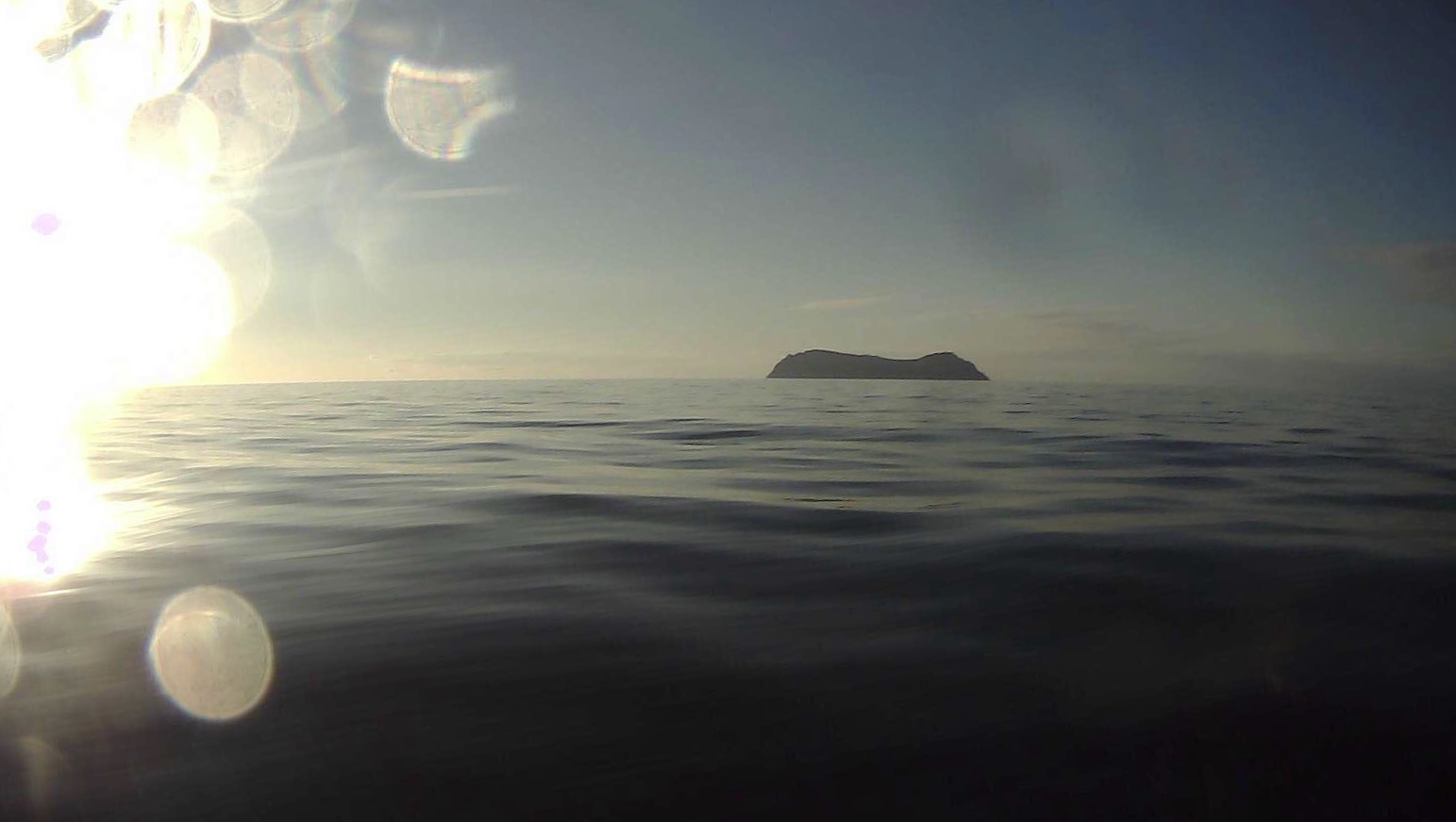 Drone view: A saildrone passes King Island, of Alaska's Bering Sea. 