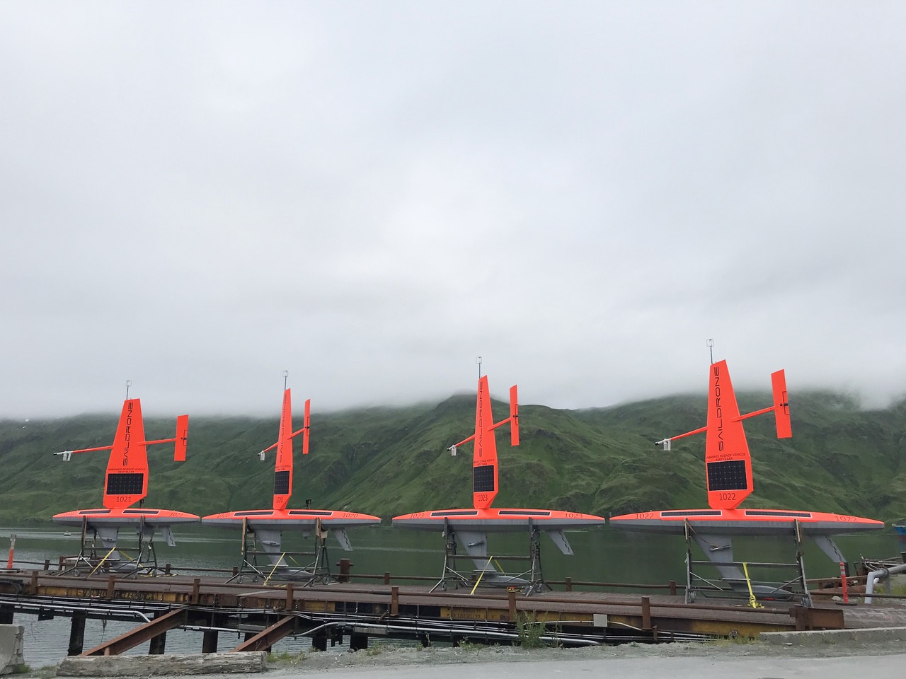 Four saildrone readied for launch on a dock in Dutch Harbor, AK. 