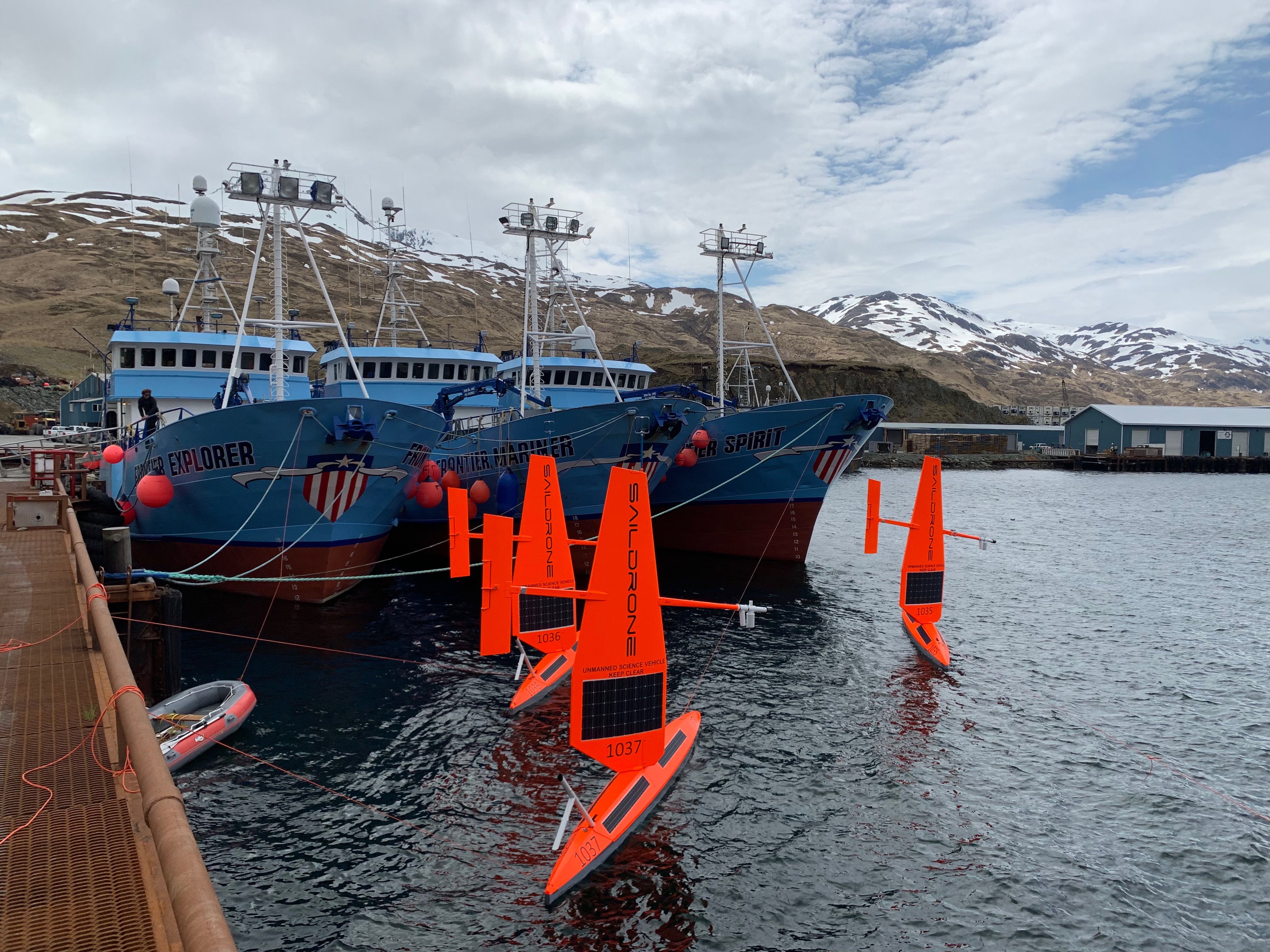 Three saildrones in port prior to launch in Dutch Harbor, Alaska.