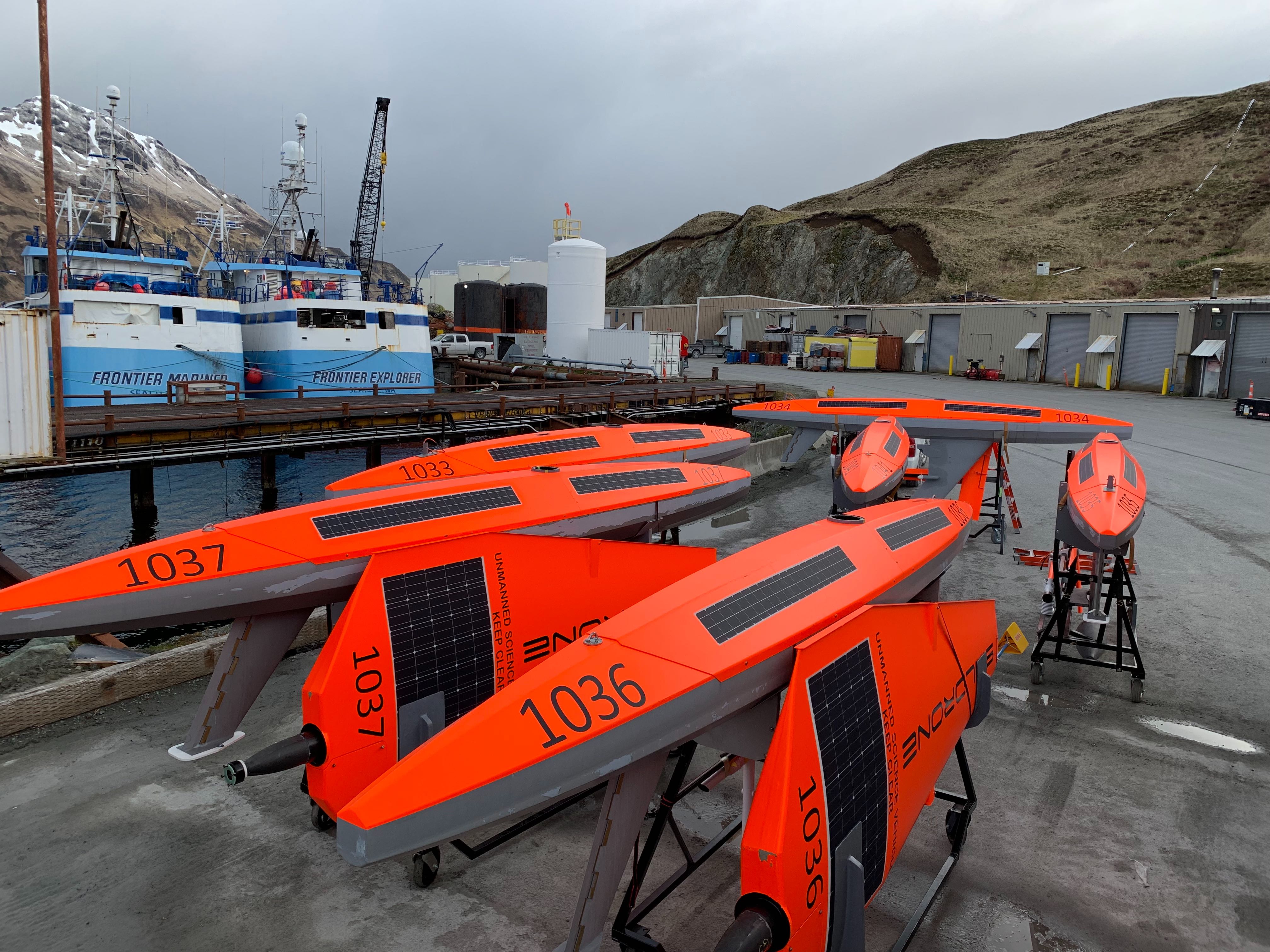 Saildrone platforms on dock ready for assembly and/or shipping