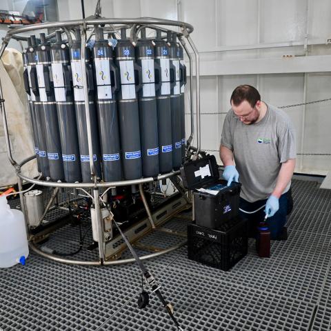 Photo credit: Dave Caress Sean McAllister filtering eDNA samples directly from a CTD Niskin Array