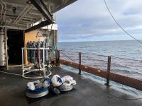 Hero deck of the NOAA Oscar Dyson with CTD niskin array and bongo nets on deck
