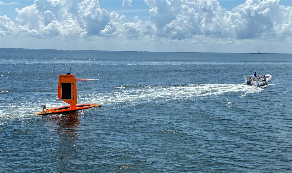 Saildrone is towed out from port at St. Petersburg