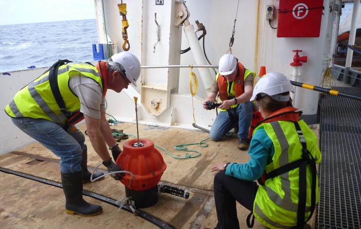 Scientists prepare to deploy Deep Argo float off New Zealand in 2014. 