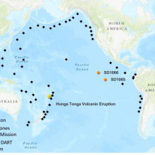 Global map showing 56 diamond icons around the rim of the Pacific Ocean with two orange circles showing saildrone locations along the equator near South America
