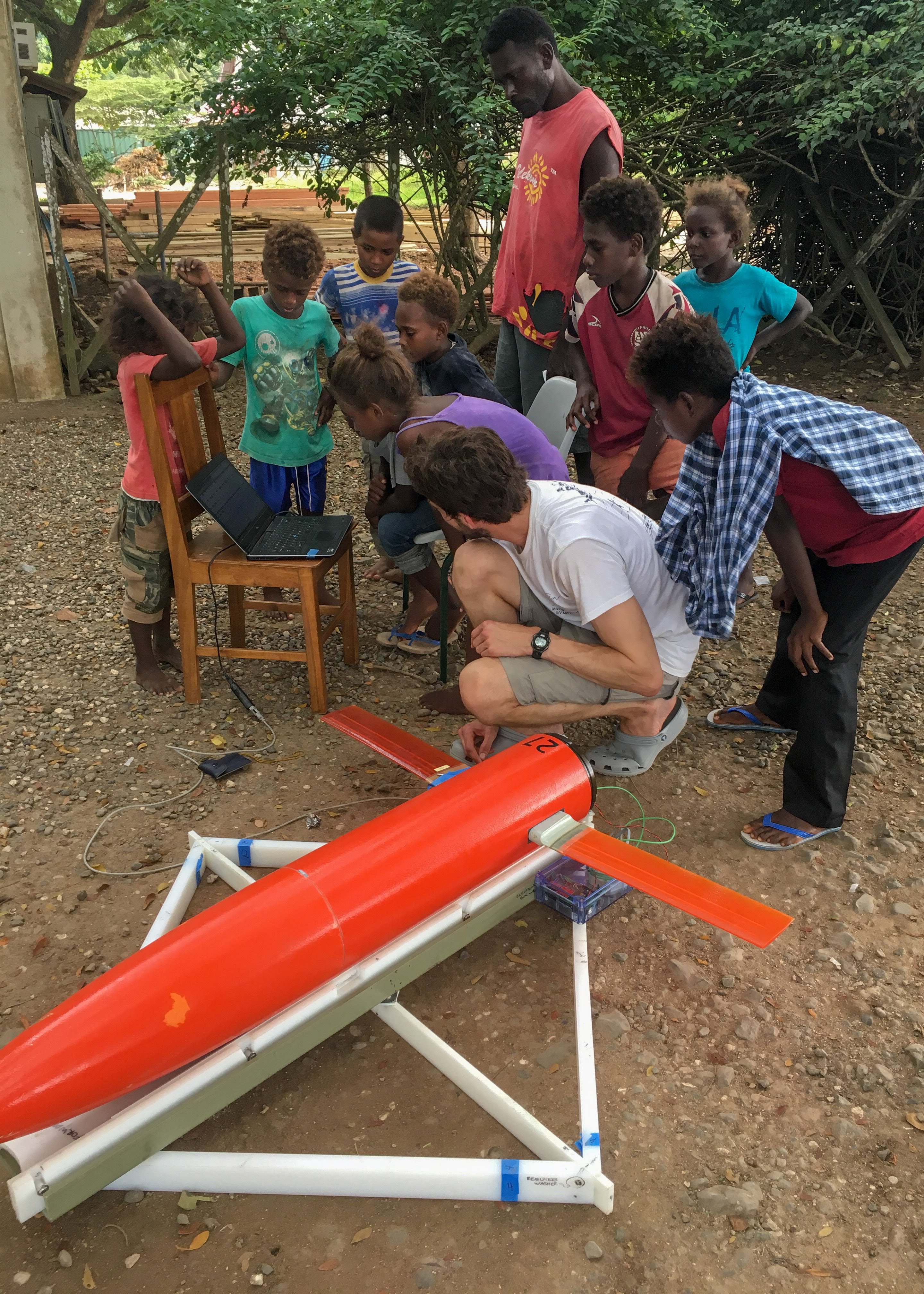 Girl calls out laptop readings to test glider satellite communications