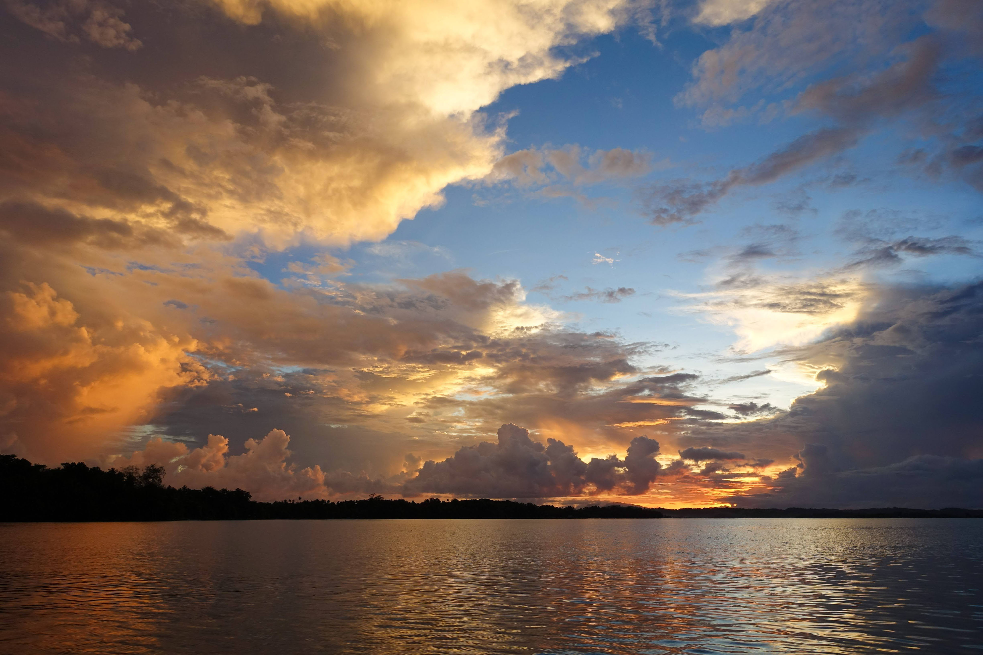 Clouds, water, and sunset over Gizo town