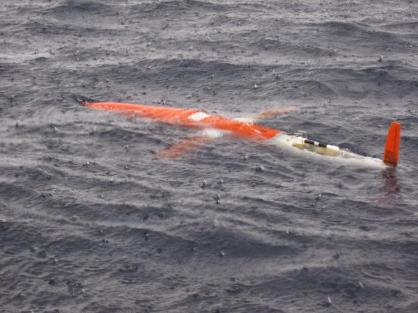 Glider at the water surface in the typical heavy rain of Gizo