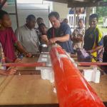 Working on a glider that drifted to Alotau, Papua New Guinea